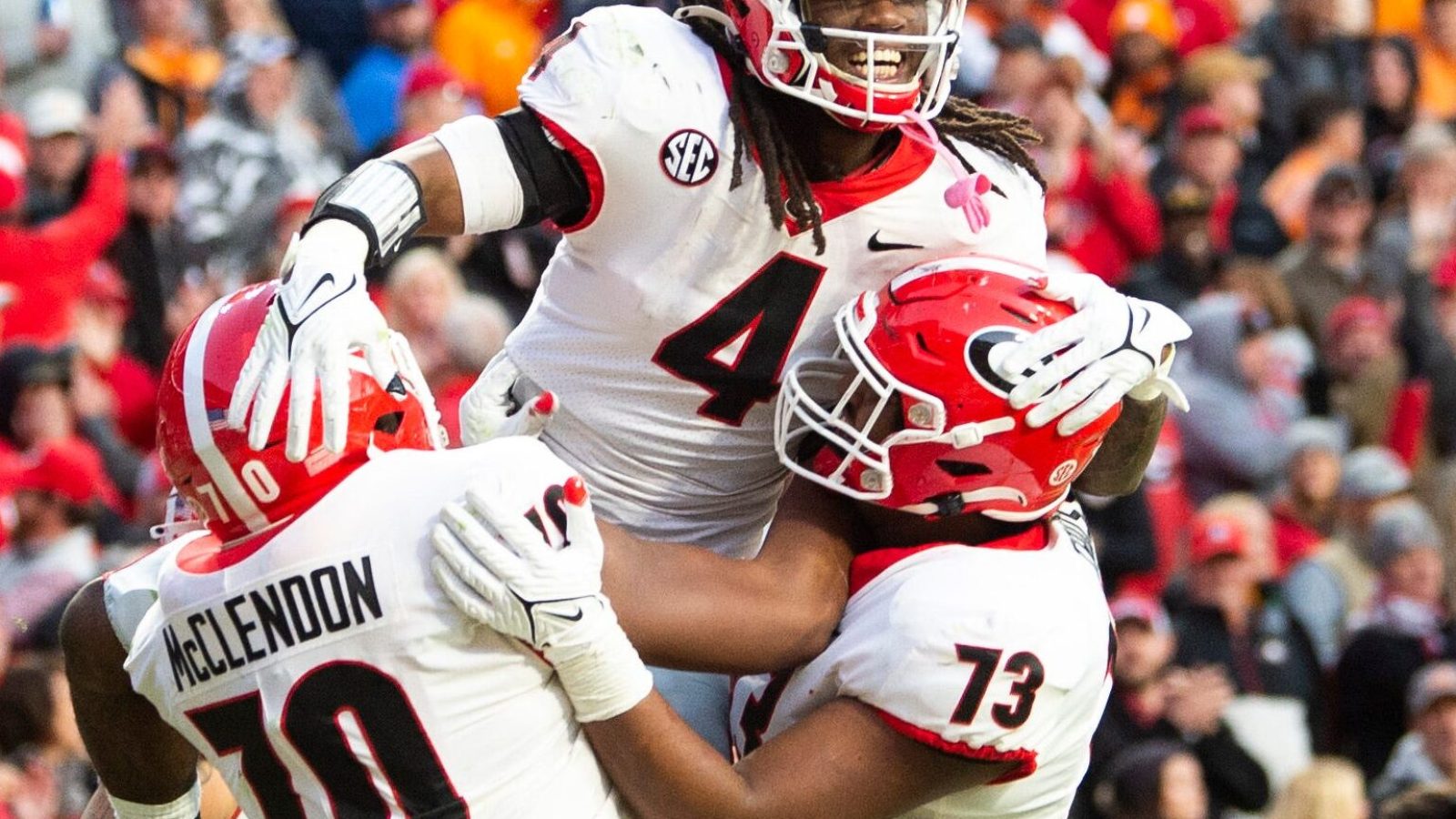Georgia running back James Cook (4) celebrates a touchdown with teammates during a game at Tennessee