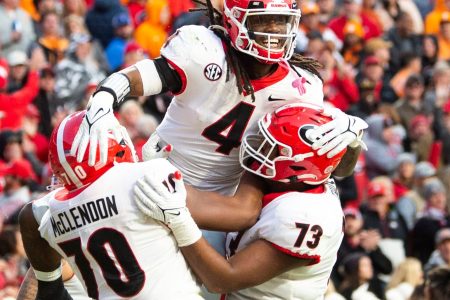 Georgia running back James Cook (4) celebrates a touchdown with teammates during a game at Tennessee