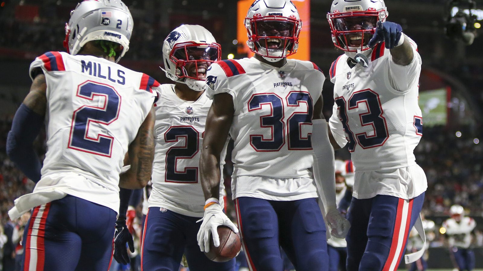 New England Patriots safety Devin McCourty (32) celebrates with cornerback Jalen Mills (2) and safety Adrian Phillips (21) and cornerback Joejuan Williams (33) after an interception against the Atlanta Falcons