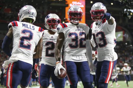 New England Patriots safety Devin McCourty (32) celebrates with cornerback Jalen Mills (2) and safety Adrian Phillips (21) and cornerback Joejuan Williams (33) after an interception against the Atlanta Falcons
