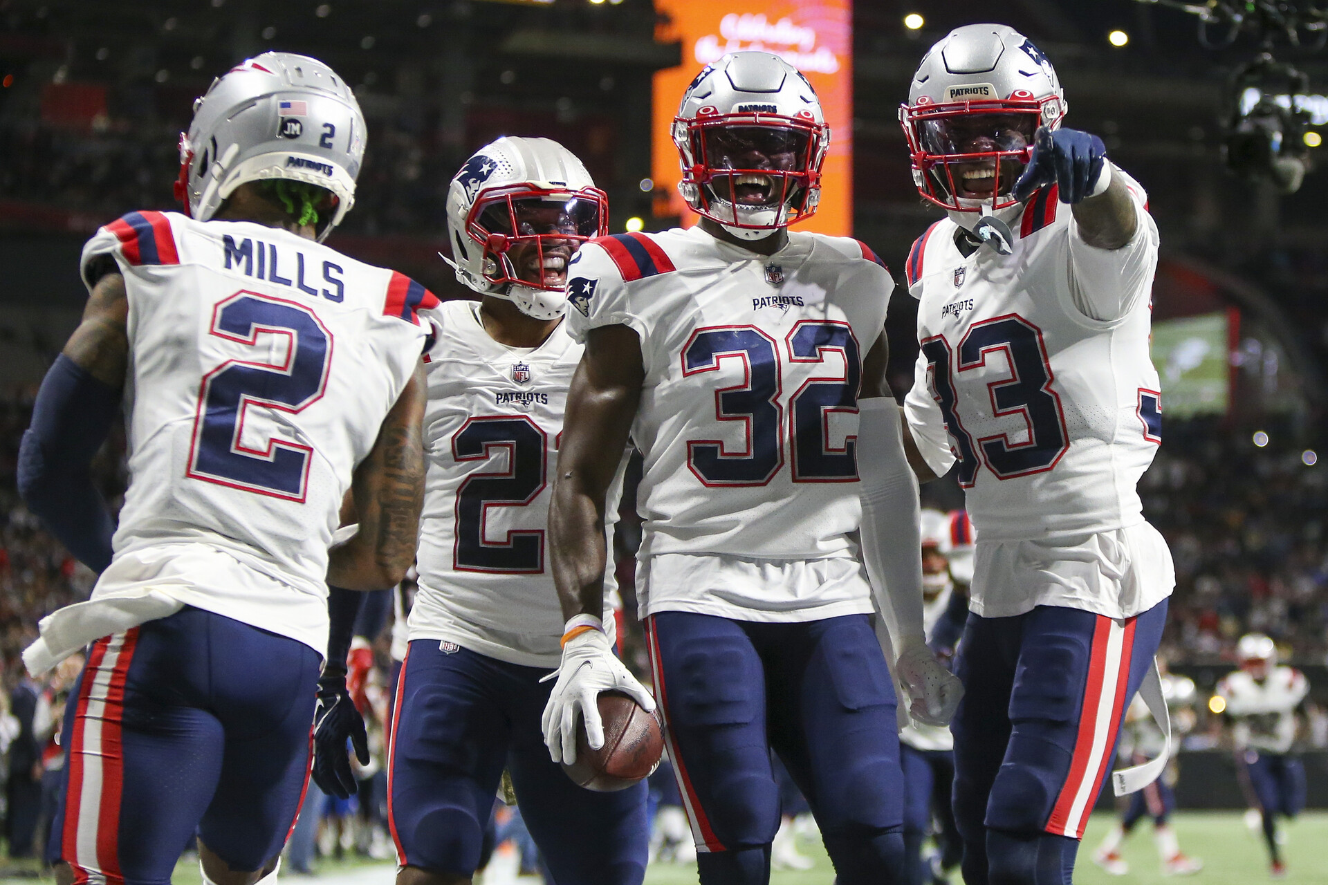New England Patriots safety Devin McCourty (32) celebrates with cornerback Jalen Mills (2) and safety Adrian Phillips (21) and cornerback Joejuan Williams (33) after an interception against the Atlanta Falcons