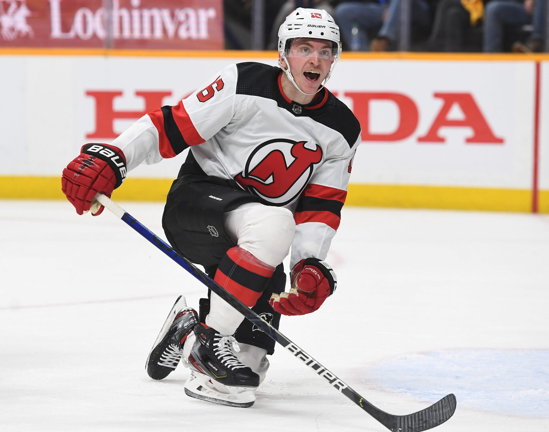 New Jersey Devils left wing Jimmy Vesey reacts after being knocked down in front of the net during a game against the Nashville Predators
