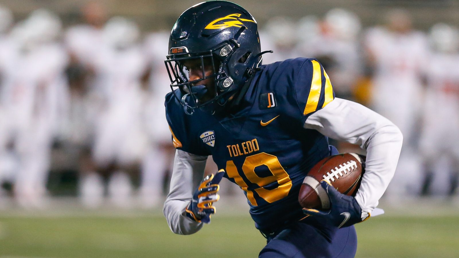 Toledo Rockets wide receiver Jerjuan Newton (19) runs with the ball after catching a pass during a regular season game between the Bowling Green Falcons and the Toledo Rockets on November 4, 2020 at Glass Bowl Stadium in Toledo, Ohio.