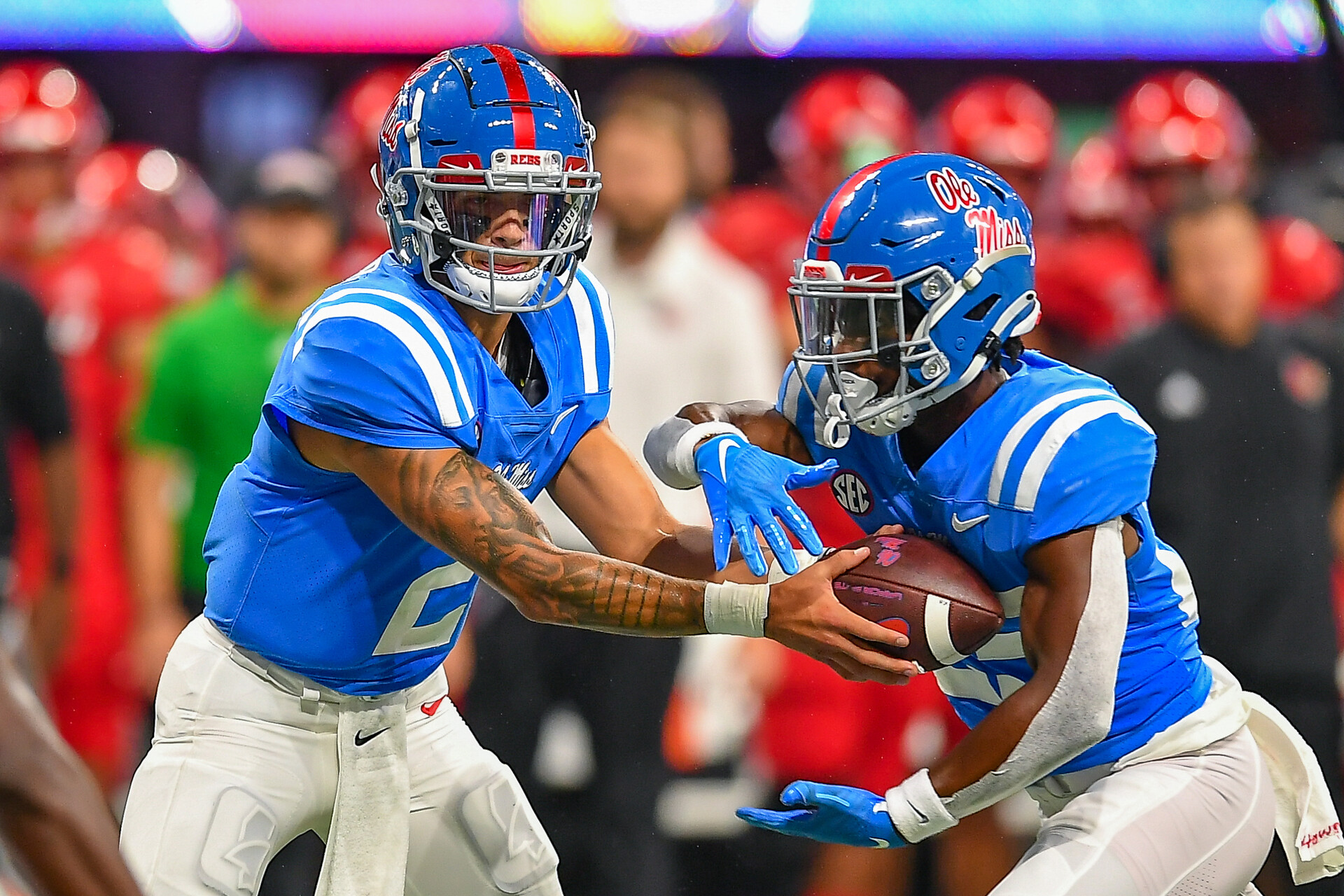 Ole Miss quarterback Matt Corral (2) hands the ball off during the Chick-fil-A Kick-Off Game between the Louisville Cardinals and the Ole Miss Rebels on September 6th, 2021 at Mercedes-Benz Stadium in Atlanta, GA.