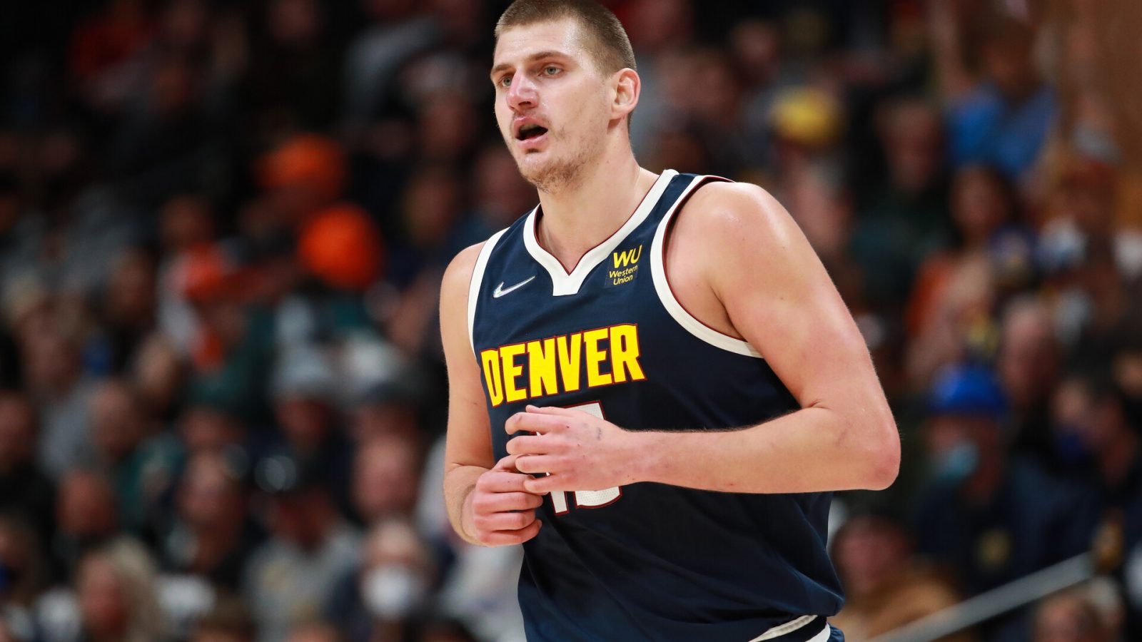 Nikola Jokic #15 of the Denver Nuggets runs down the court during the game against the Portland Trail Blazers at Ball Arena on November 14, 2021 in Denver, Colorado.
