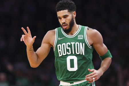 Jayson Tatum #0 of the Boston Celtics reacts after hitting a three-point shot during a game against the Milwaukee Bucks at TD Garden on December 13, 2021 in Boston, Massachusetts.