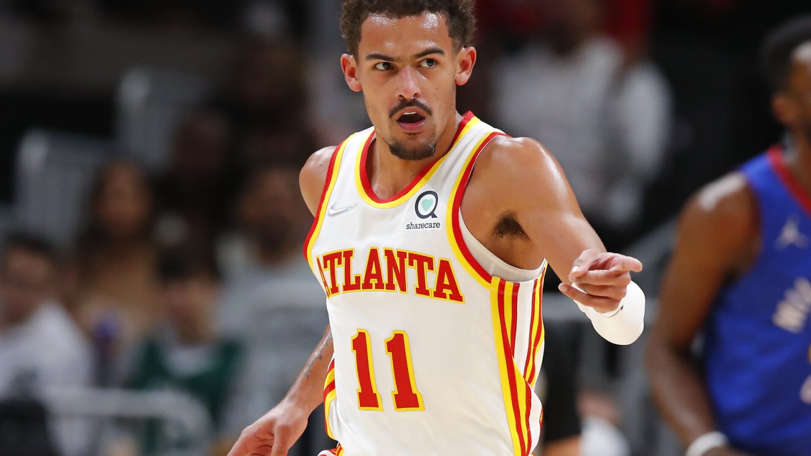 Trae Young #11 of the Atlanta Hawks reacts during the first half against the Denver Nuggets at State Farm Arena on December 17, 2021 in Atlanta, Georgia