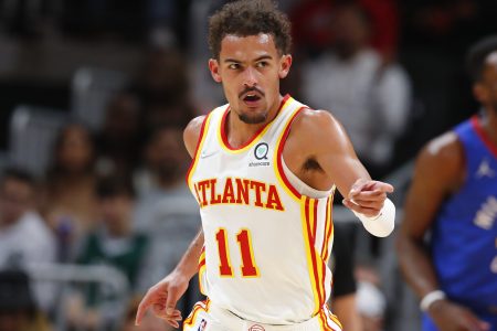 Trae Young #11 of the Atlanta Hawks reacts during the first half against the Denver Nuggets at State Farm Arena on December 17, 2021 in Atlanta, Georgia