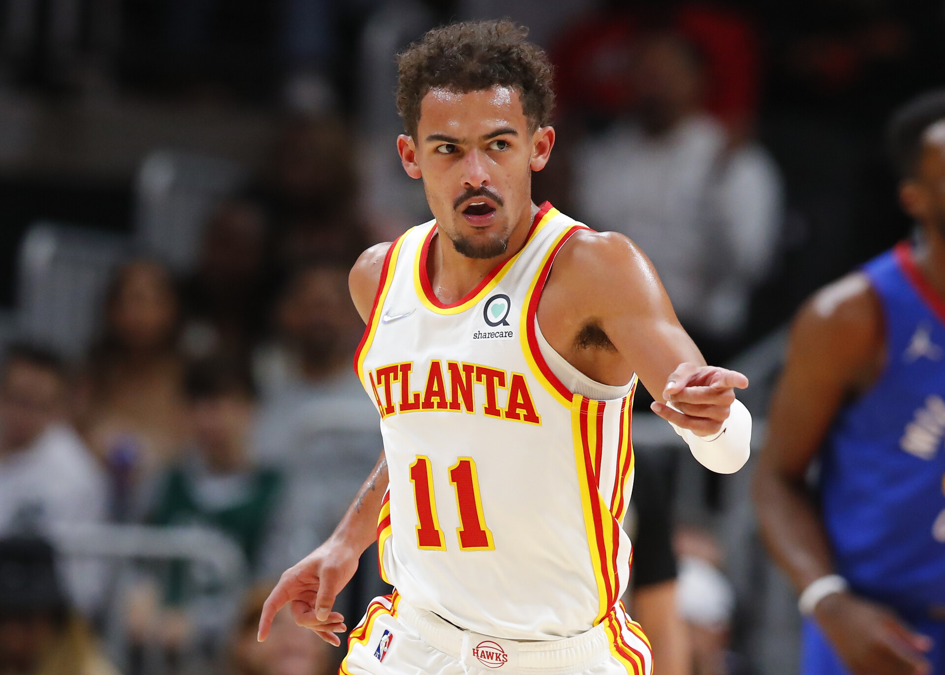Trae Young #11 of the Atlanta Hawks reacts during the first half against the Denver Nuggets at State Farm Arena on December 17, 2021 in Atlanta, Georgia