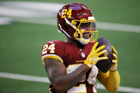 Antonio Gibson #24 of the Washington Football Team reacts after a reception during the second quarter of a game against the Dallas Cowboys at AT&T Stadium on November 26, 2020 in Arlington, Texas.