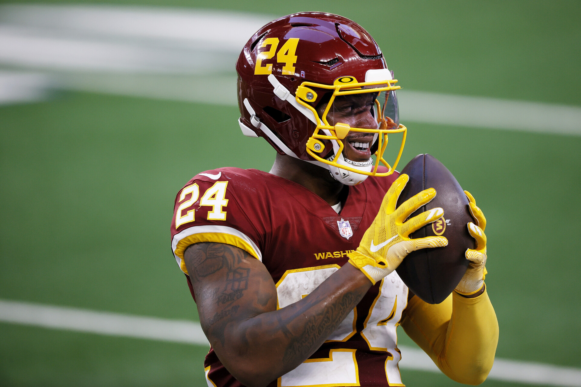 Antonio Gibson #24 of the Washington Football Team reacts after a reception during the second quarter of a game against the Dallas Cowboys at AT&T Stadium on November 26, 2020 in Arlington, Texas.