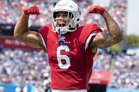 James Conner #6 celebrates with DeAndre Hopkins #10 of the Arizona Cardinals after a touchdown during the game against the Tennessee Titans at Nissan Stadium on September 12, 2021 in Nashville, Tennessee.