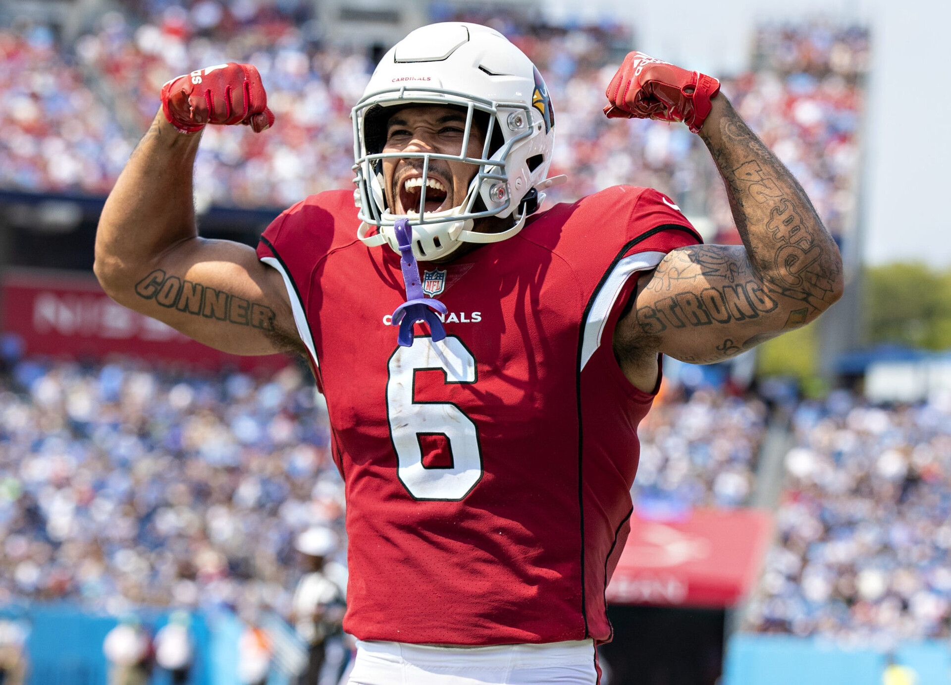 James Conner #6 celebrates with DeAndre Hopkins #10 of the Arizona Cardinals after a touchdown during the game against the Tennessee Titans at Nissan Stadium on September 12, 2021 in Nashville, Tennessee.