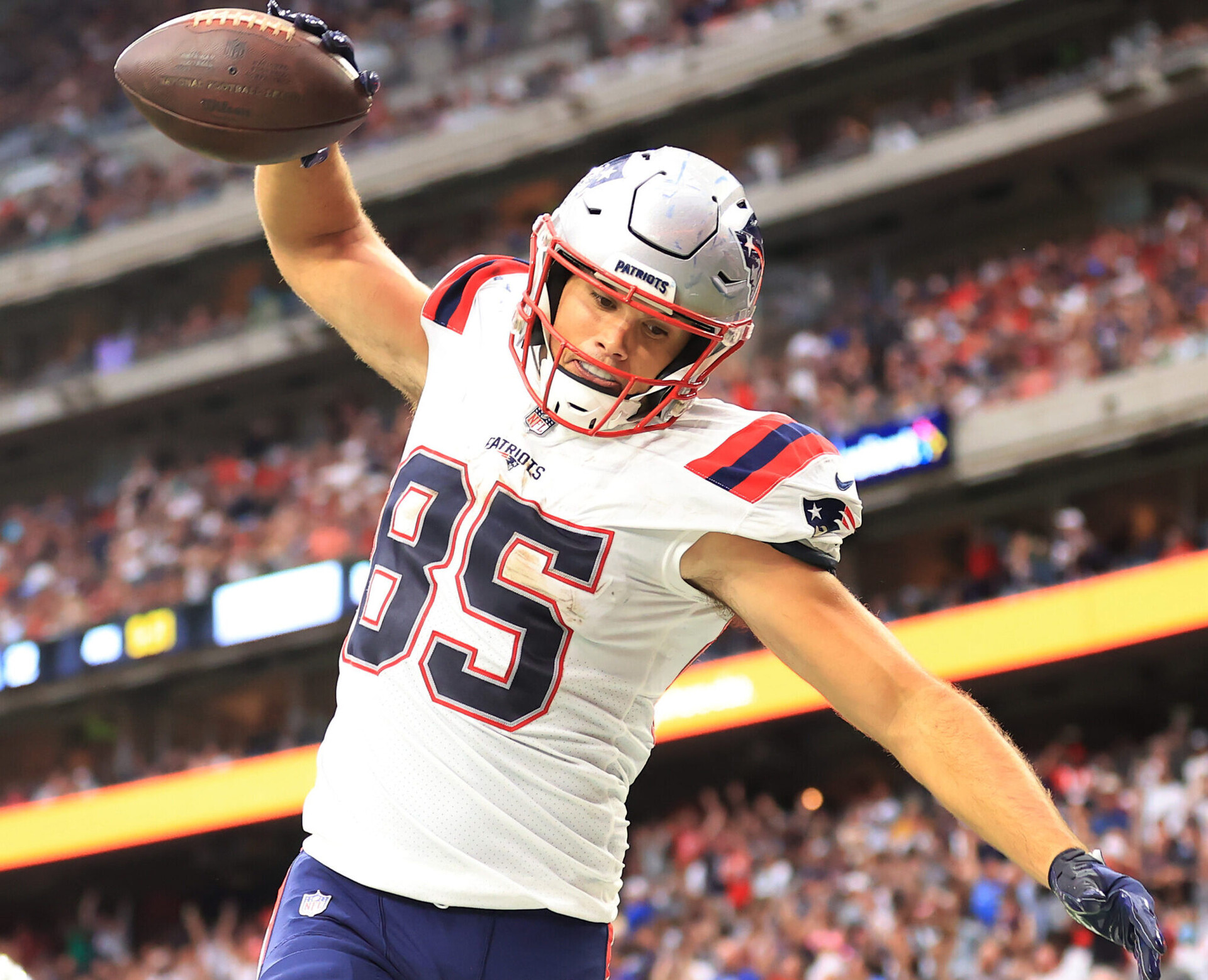 Hunter Henry #85 of the New England Patriots celebrates a touchdown during the second half against the Houston Texans at NRG Stadium on October 10, 2021 in Houston, Texas.