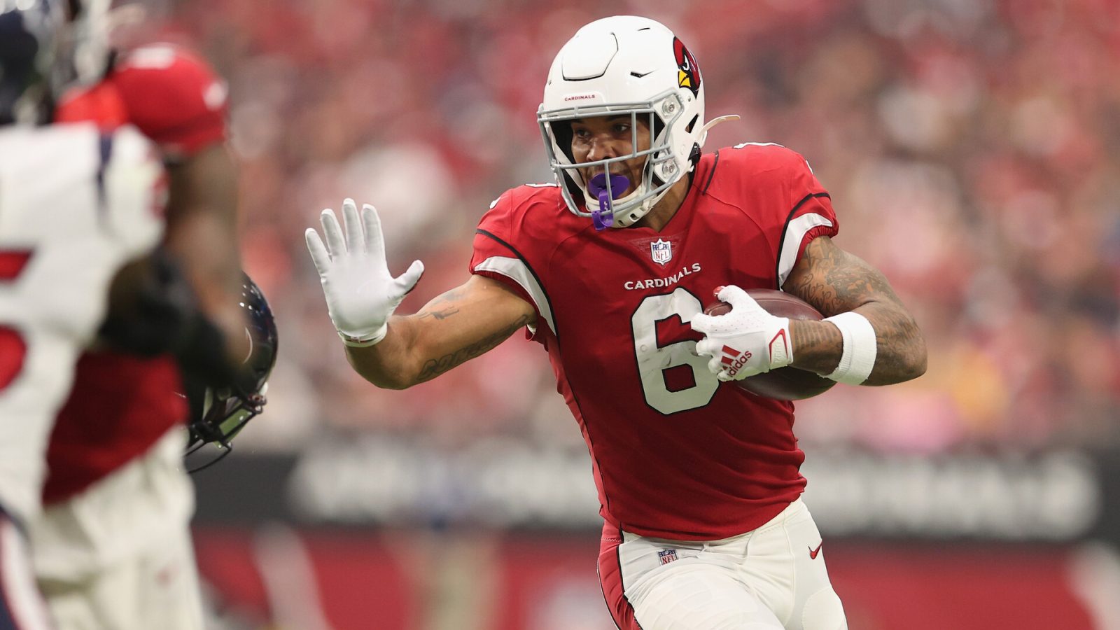 Running back James Conner #6 of the Arizona Cardinals rushes the football against the Houston Texans during the NFL game at State Farm Stadium on October 24, 2021 in Glendale, Arizona. The Cardinals defeated the Texans 31-5.