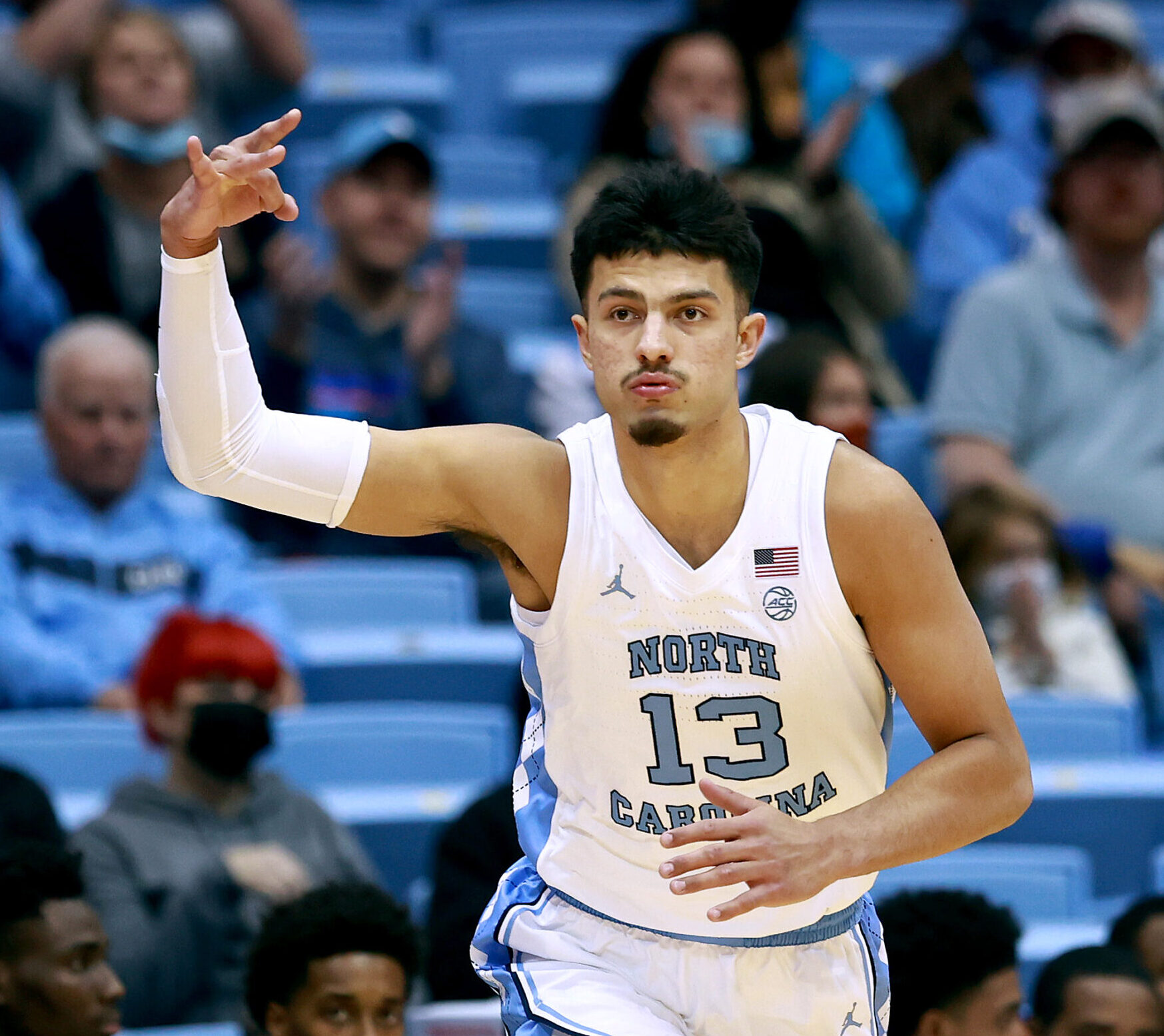 Dawson Garcia #13 of the North Carolina Tar Heels reacts after a three-point basket against the Elizabeth City State Vikings during their game at the Dean E. Smith Center on November 05, 2021 in Chapel Hill, North Carolina. The Tar Heels won 83-55.