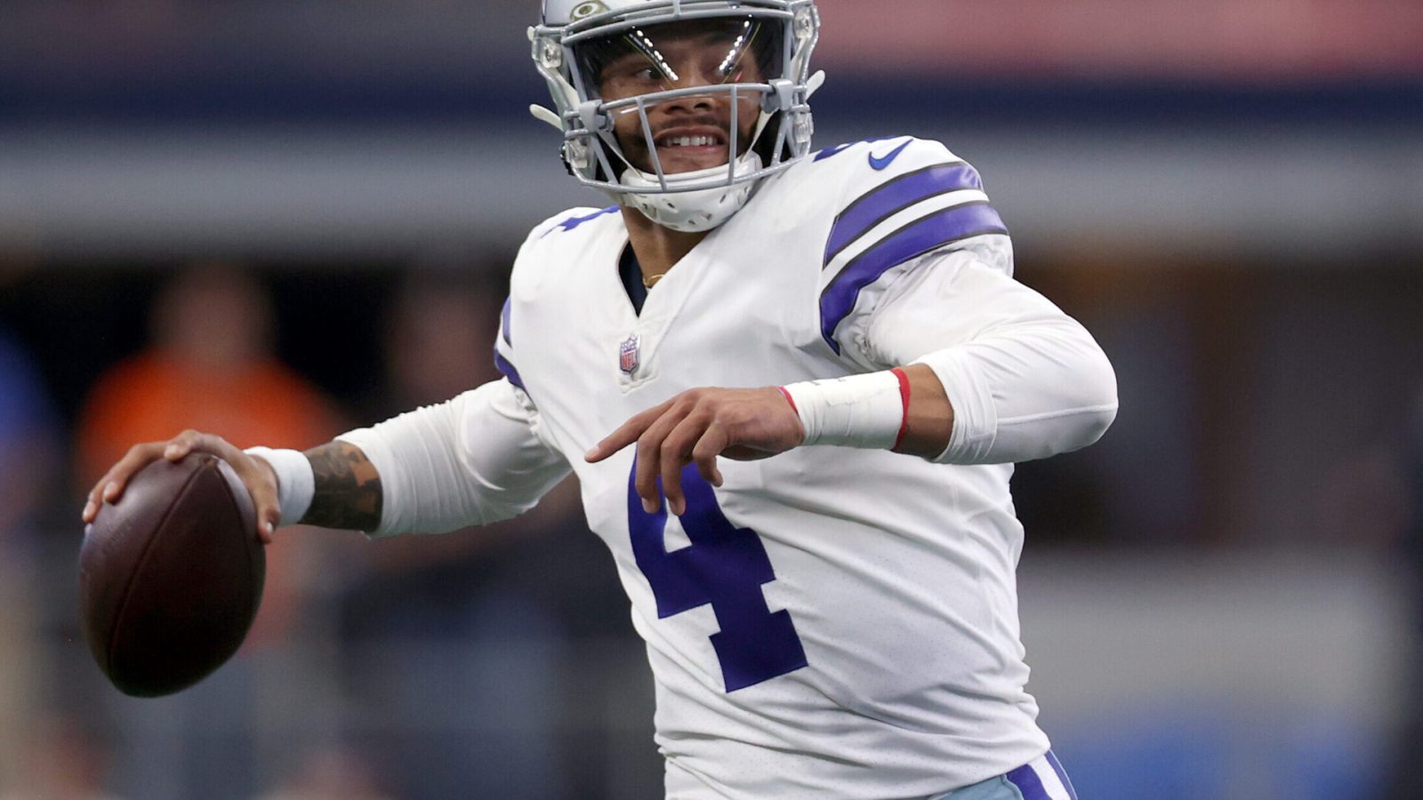 Dak Prescott #4 of the Dallas Cowboys scrambles with the ball during the first quarter against the Denver Broncos at AT&T Stadium on November 07, 2021 in Arlington, Texas