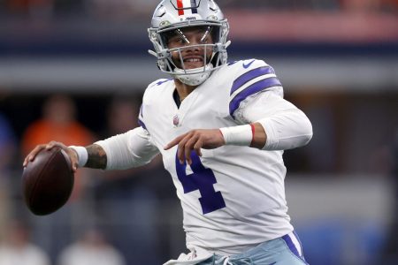 Dak Prescott #4 of the Dallas Cowboys scrambles with the ball during the first quarter against the Denver Broncos at AT&T Stadium on November 07, 2021 in Arlington, Texas
