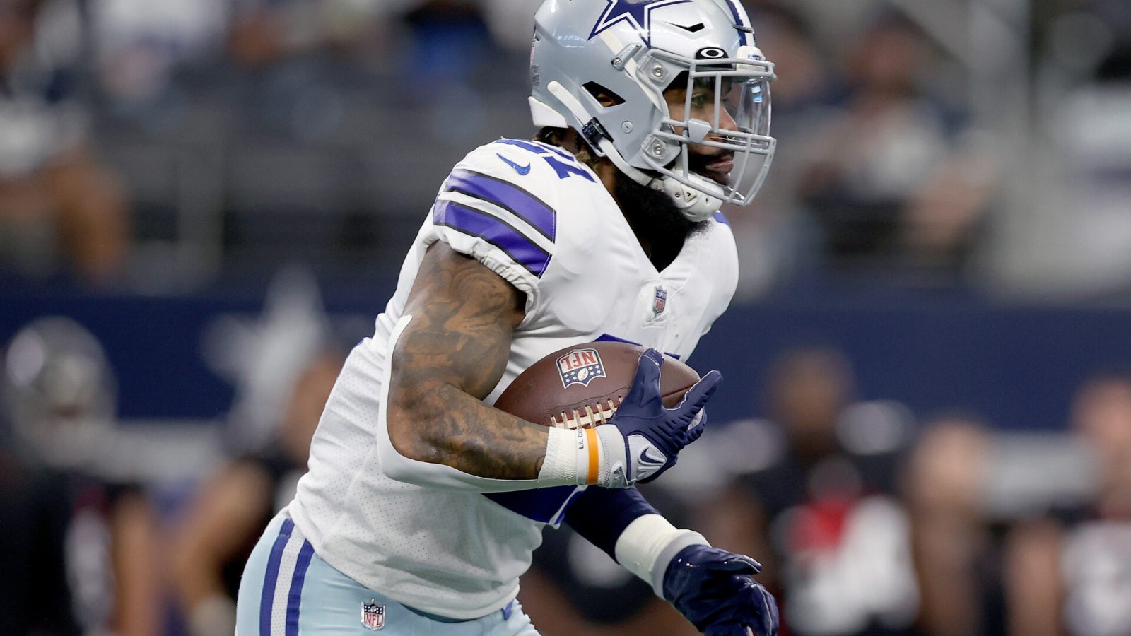 Ezekiel Elliott #21 of the Dallas Cowboys carries the ball against the Atlanta Falcons at AT&T Stadium on November 14, 2021 in Arlington, Texas.