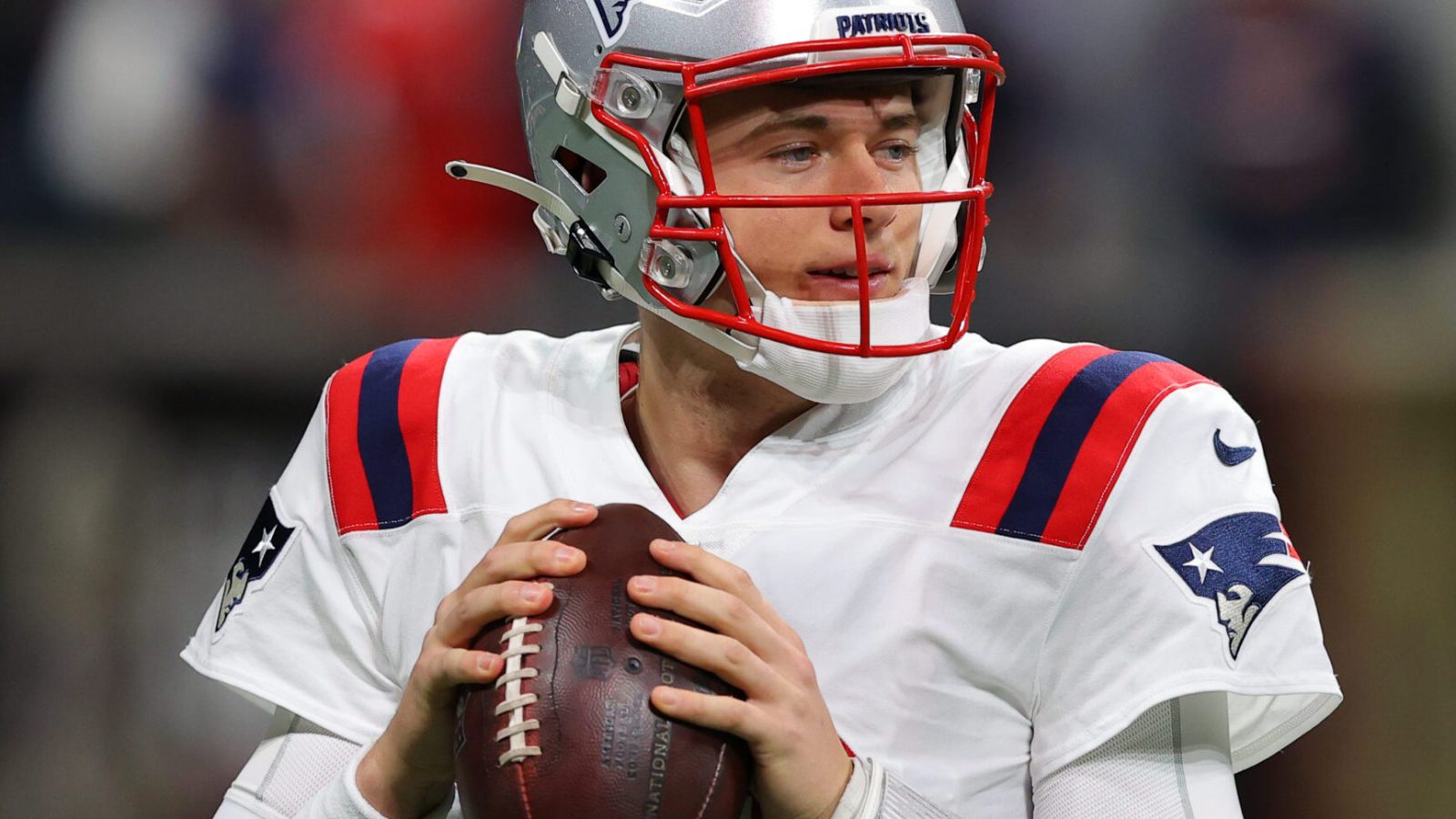 Mac Jones #10 of the New England Patriots warms up prior to playing the Atlanta Falcons at Mercedes-Benz Stadium on November 18, 2021 in Atlanta, Georgia.