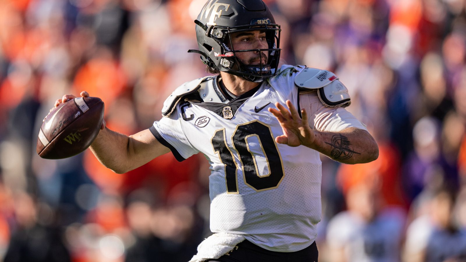 Quarterback Sam Hartman #10 of the Wake Forest Demon Deacons looks to pass against the Clemson Tigers in the fourth quarter during their game at Clemson Memorial Stadium on November 20, 2021 in Clemson, South Carolina.