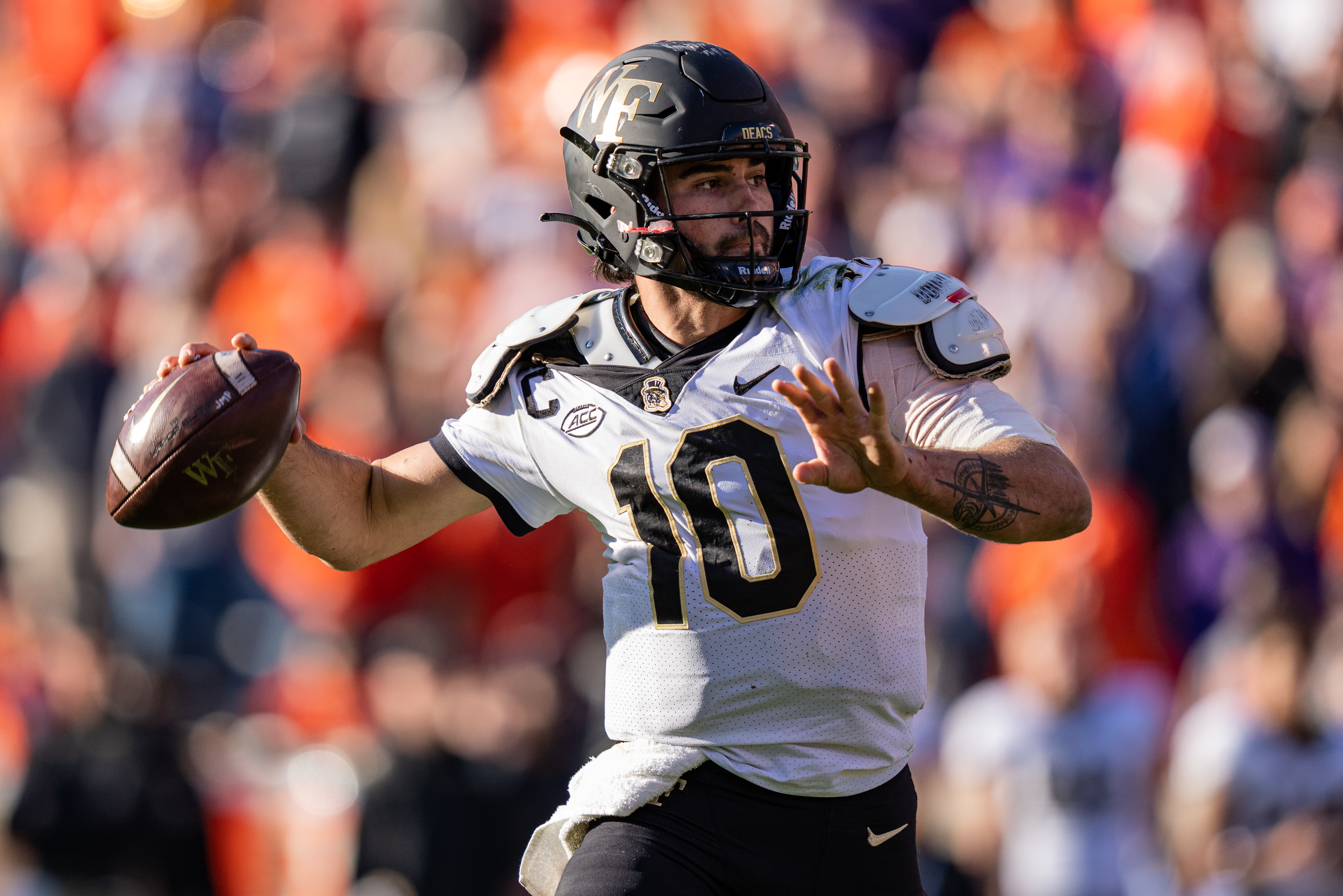Quarterback Sam Hartman #10 of the Wake Forest Demon Deacons looks to pass against the Clemson Tigers in the fourth quarter during their game at Clemson Memorial Stadium on November 20, 2021 in Clemson, South Carolina.