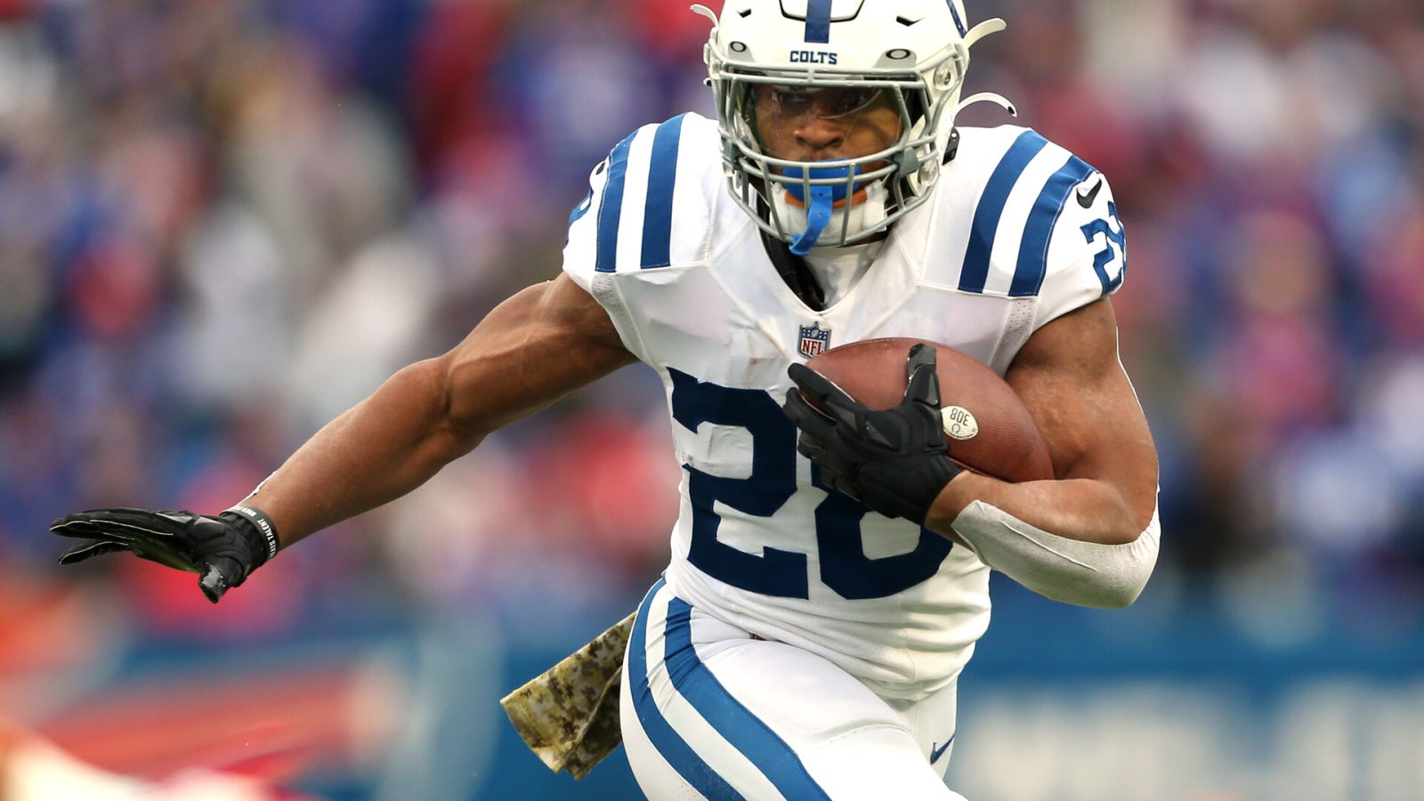 Jonathan Taylor #28 of the Indianapolis Colts runs the ball in the game against the Buffalo Bills during the first quarter at Highmark Stadium on November 21, 2021 in Orchard Park, New York.