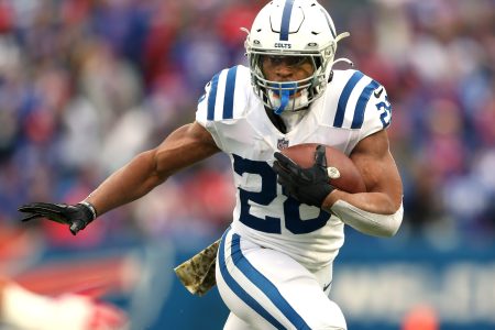 Jonathan Taylor #28 of the Indianapolis Colts runs the ball in the game against the Buffalo Bills during the first quarter at Highmark Stadium on November 21, 2021 in Orchard Park, New York.