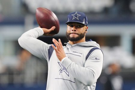 Dak Prescott #4 of the Dallas Cowboys warms up ahead of the NFL game between Las Vegas Raiders and Dallas Cowboys at AT&T Stadium on November 25, 2021 in Arlington, Texas.