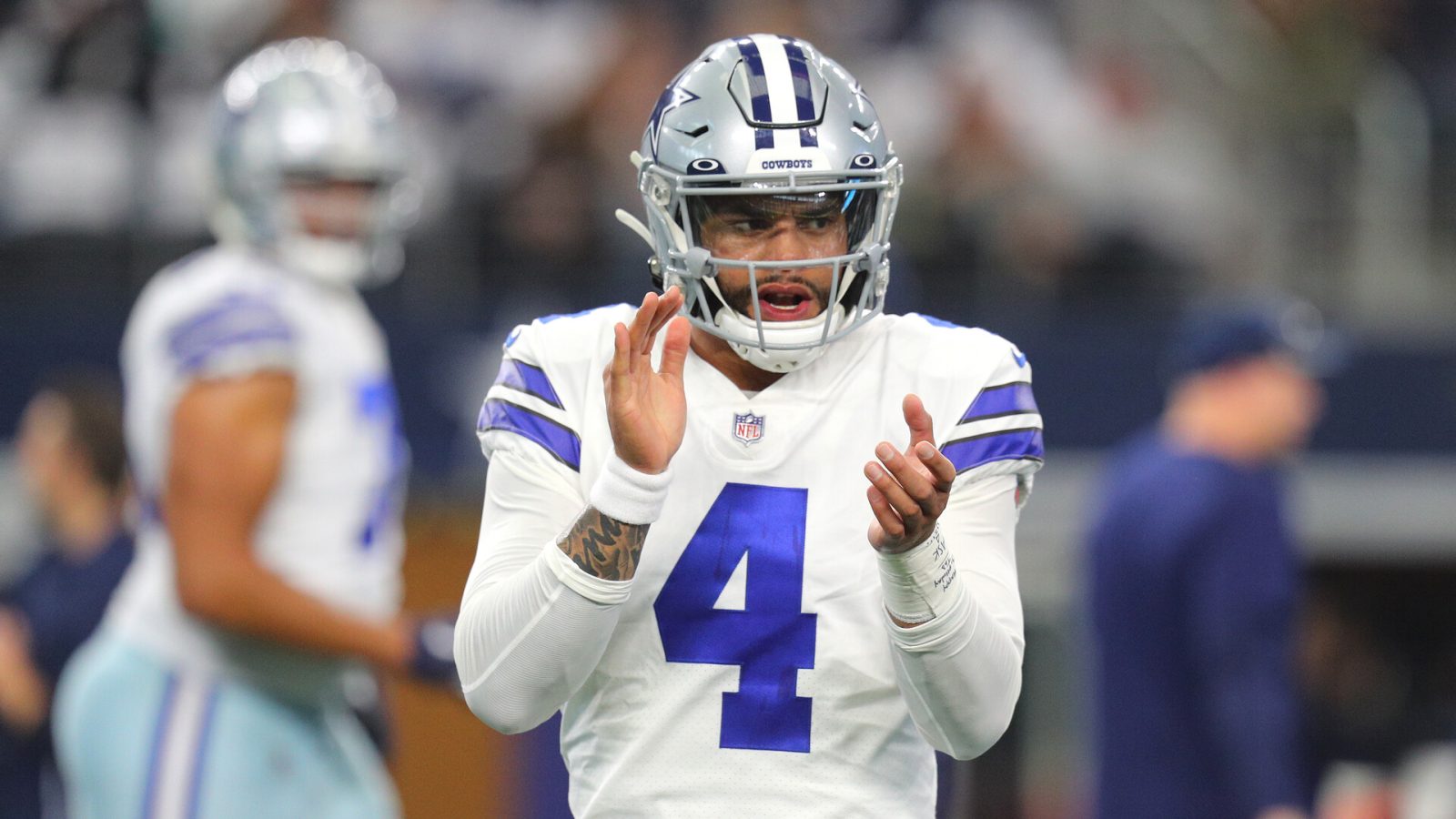 Dak Prescott #4 of the Dallas Cowboys warms up ahead of the NFL game between Las Vegas Raiders and Dallas Cowboys at AT&T Stadium on November 25, 2021 in Arlington, Texas.