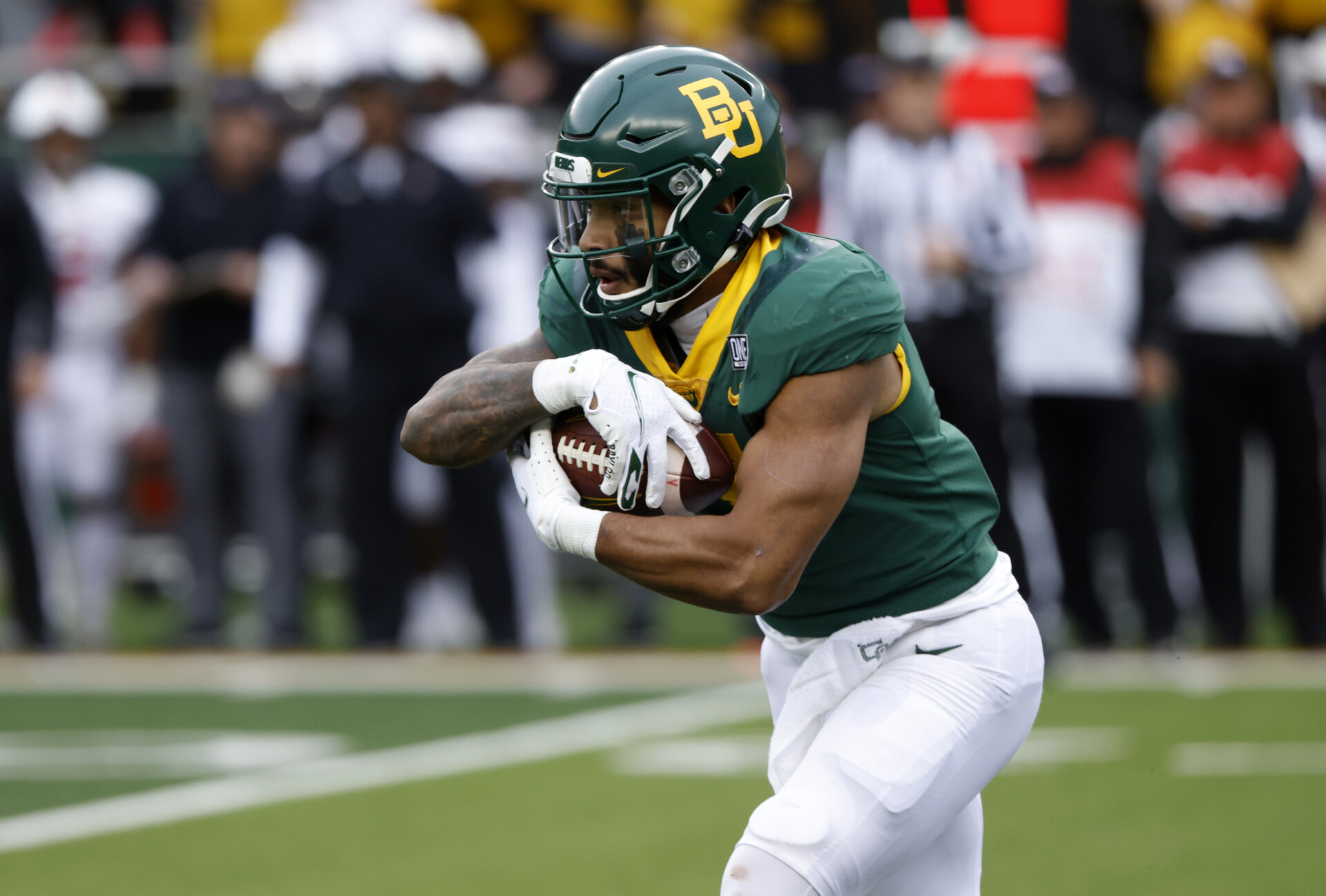Abram Smith #7 of the Baylor Bears carries the ball against the Texas Tech Red Raiders in the first half at McLane Stadium on November 27, 2021 in Waco, Texas. 