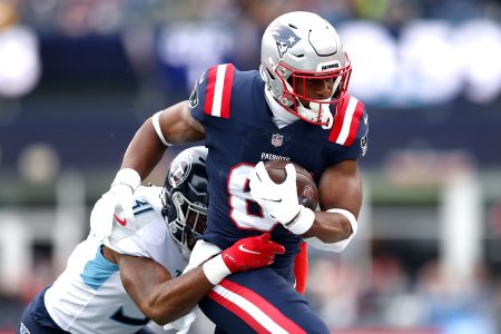 Kevin Byard #31 of the Tennessee Titans tackles Jonnu Smith #81 of the New England Patriots in the first quarter at Gillette Stadium on November 28, 2021 in Foxborough, Massachusetts.