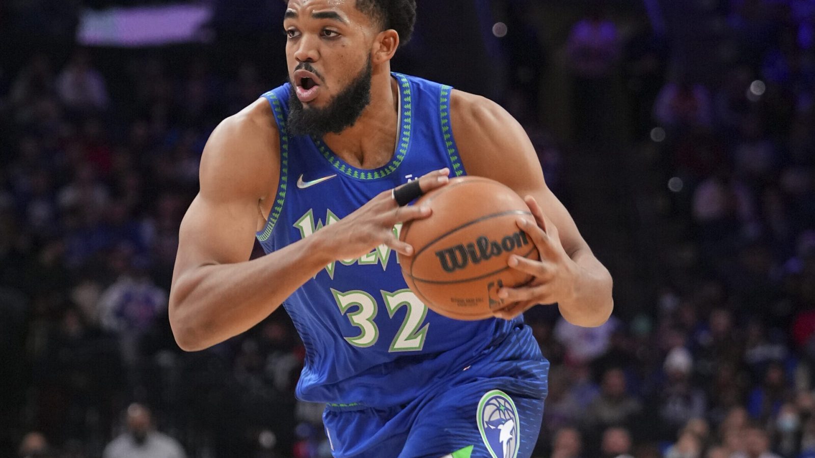 Karl-Anthony Towns #32 of the Minnesota Timberwolves drives to the basket against the Philadelphia 76ers at the Wells Fargo Center on November 27, 2021 in Philadelphia, Pennsylvania. The Timberwolves defeated the 76ers 121-120 in double overtime.