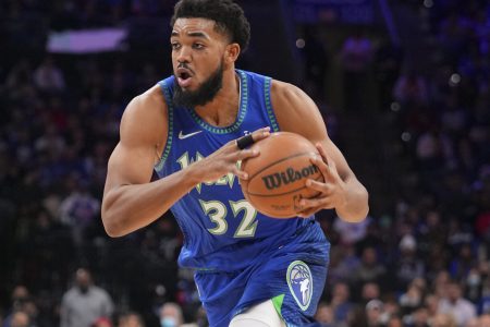 Karl-Anthony Towns #32 of the Minnesota Timberwolves drives to the basket against the Philadelphia 76ers at the Wells Fargo Center on November 27, 2021 in Philadelphia, Pennsylvania. The Timberwolves defeated the 76ers 121-120 in double overtime.