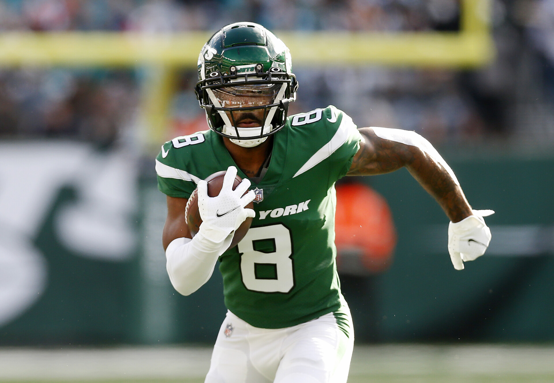 Elijah Moore #8 of the New York Jets in action against the Miami Dolphins at MetLife Stadium on November 21, 2021 in East Rutherford, New Jersey.