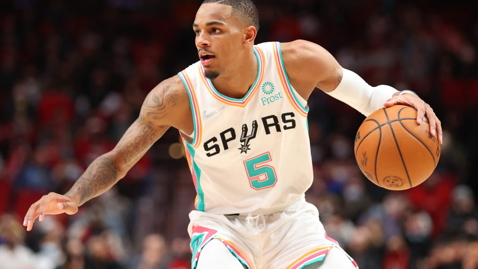 Dejounte Murray #5 of the San Antonio Spurs handles the ball against the Portland Trail Blazers during the fourth quarter at Moda Center on December 02, 2021 in Portland, Oregon.
