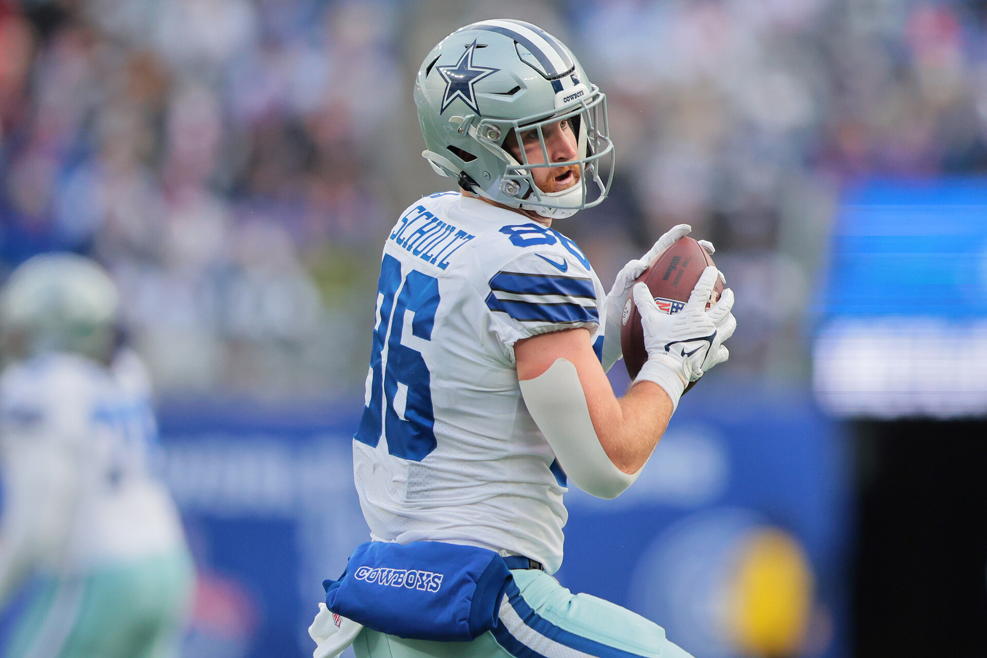 Dalton Schultz #86 of the Dallas Cowboys runs the ball after a catch during the first half against the New York Giants at MetLife Stadium on December 19, 2021 in East Rutherford, New Jersey.