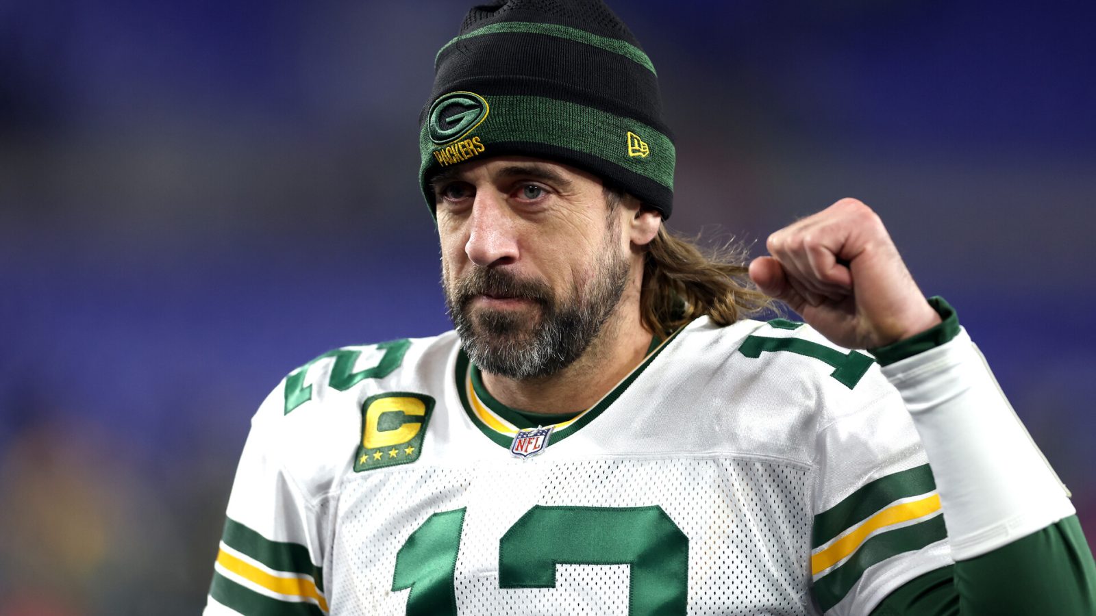 Aaron Rodgers of the Green Bay Packers celebrates as he walks off the field after their game against the Baltimore Ravens at M&T Bank Stadium on December 19, 2021 in Baltimore, Maryland.