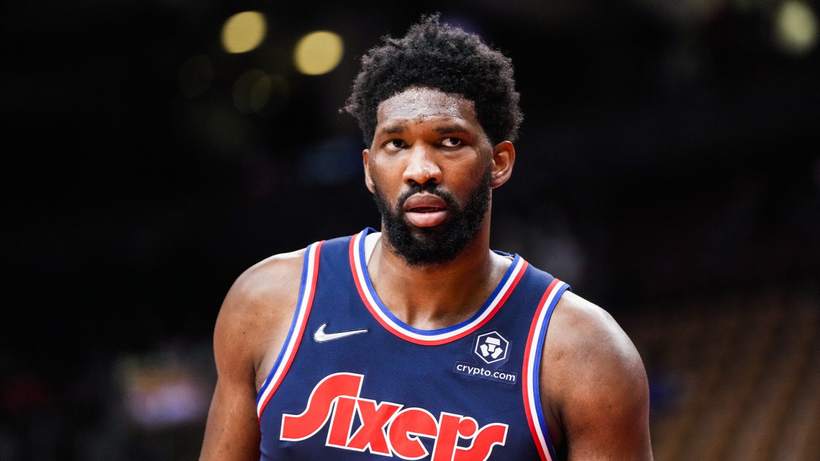 Joel Embiid #21 of the Philadelphia 76ers looks on against the Toronto Raptors during the second half of their basketball game at the Scotiabank Arena on December 28, 2021 in Toronto, Ontario, Canada.