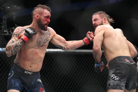 Santiago Ponzinibbio (left) throws a left uppercut at opponent Mike Perry during UFC Fight Night