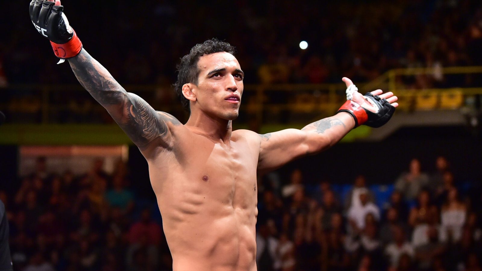 UFC fighter Charles Oliveira celebrates after a victory over Jared Gordon