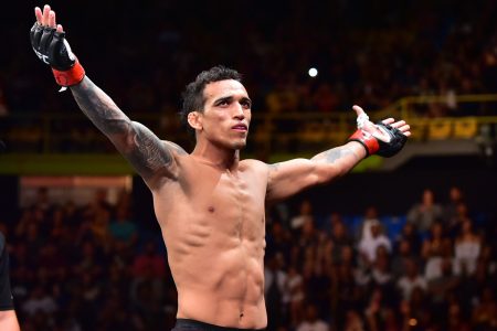 UFC fighter Charles Oliveira celebrates after a victory over Jared Gordon