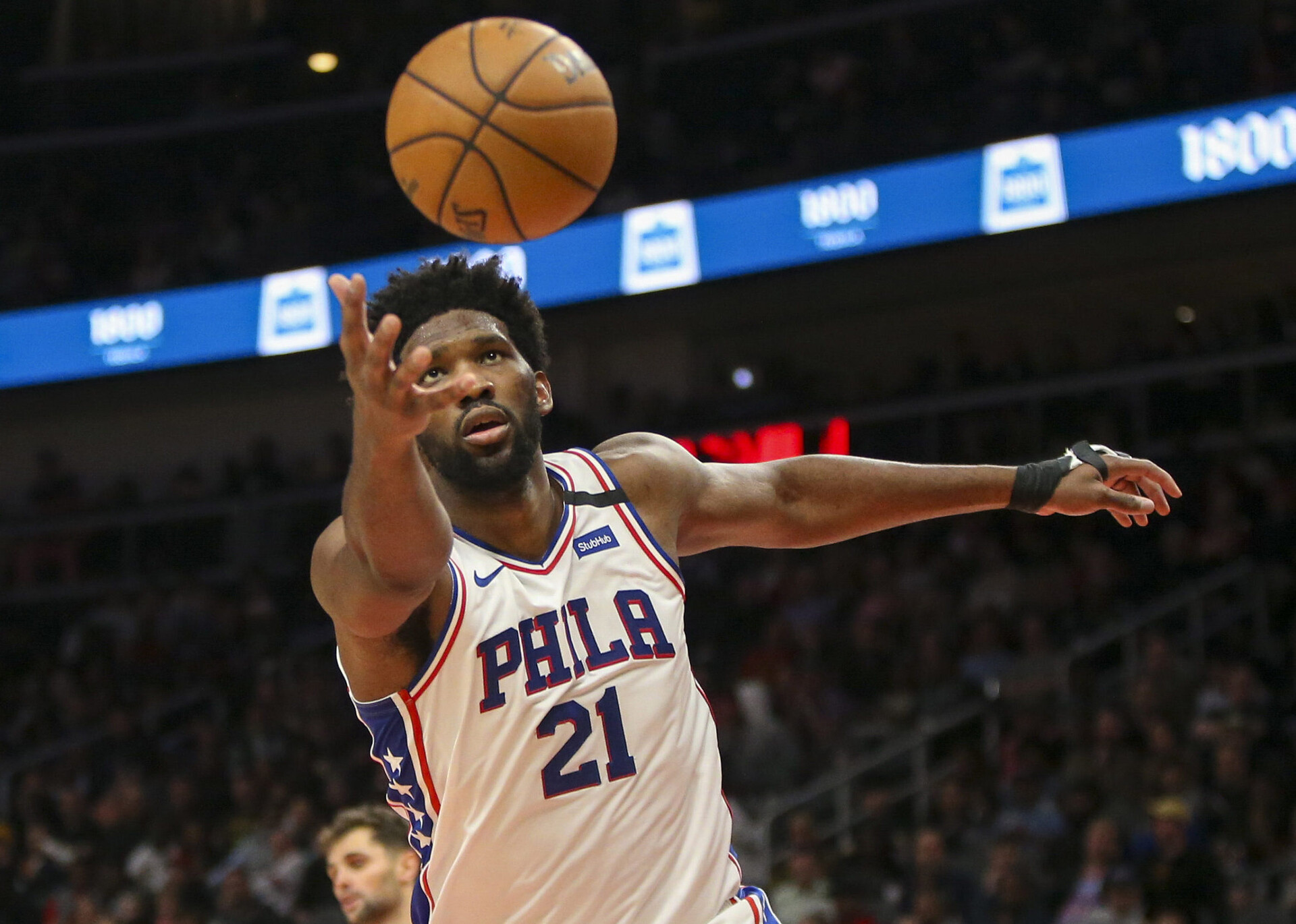 Philadelphia 76ers center Joel Embiid tries to grab a rebound against the Atlanta Hawks