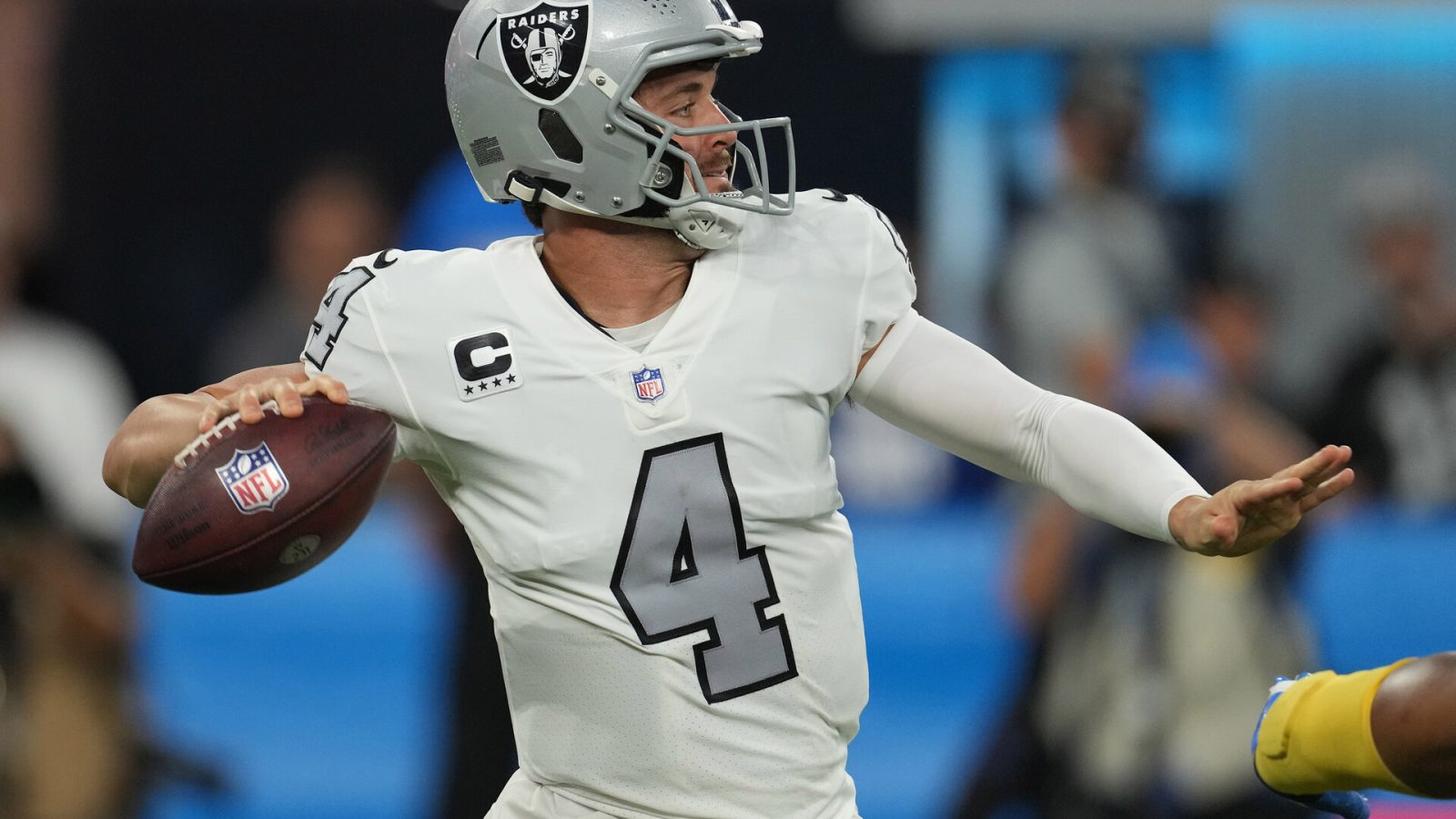 Las Vegas Raiders quarterback Derek Carr (4) throws a pass against the Los Angeles Chargers during the first half at SoFi Stadium.