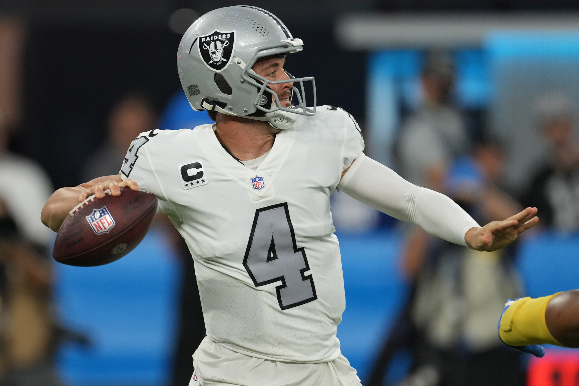 Las Vegas Raiders quarterback Derek Carr (4) throws a pass against the Los Angeles Chargers during the first half at SoFi Stadium.
