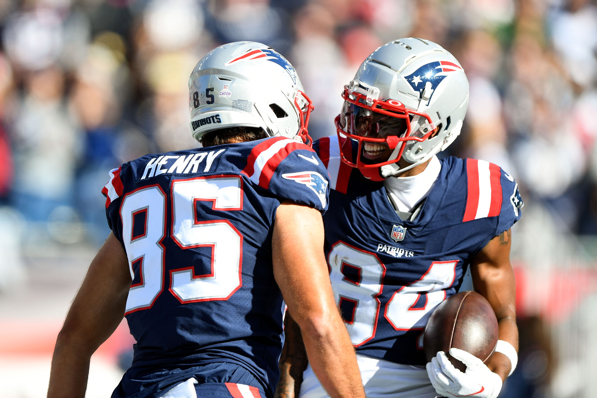 New England Patriots tight end Hunter Henry (85) celebrates with wide receiver Kendrick Bourne (84) after scoring a touchdown against the New York Jets during the first half at Gillette Stadium.