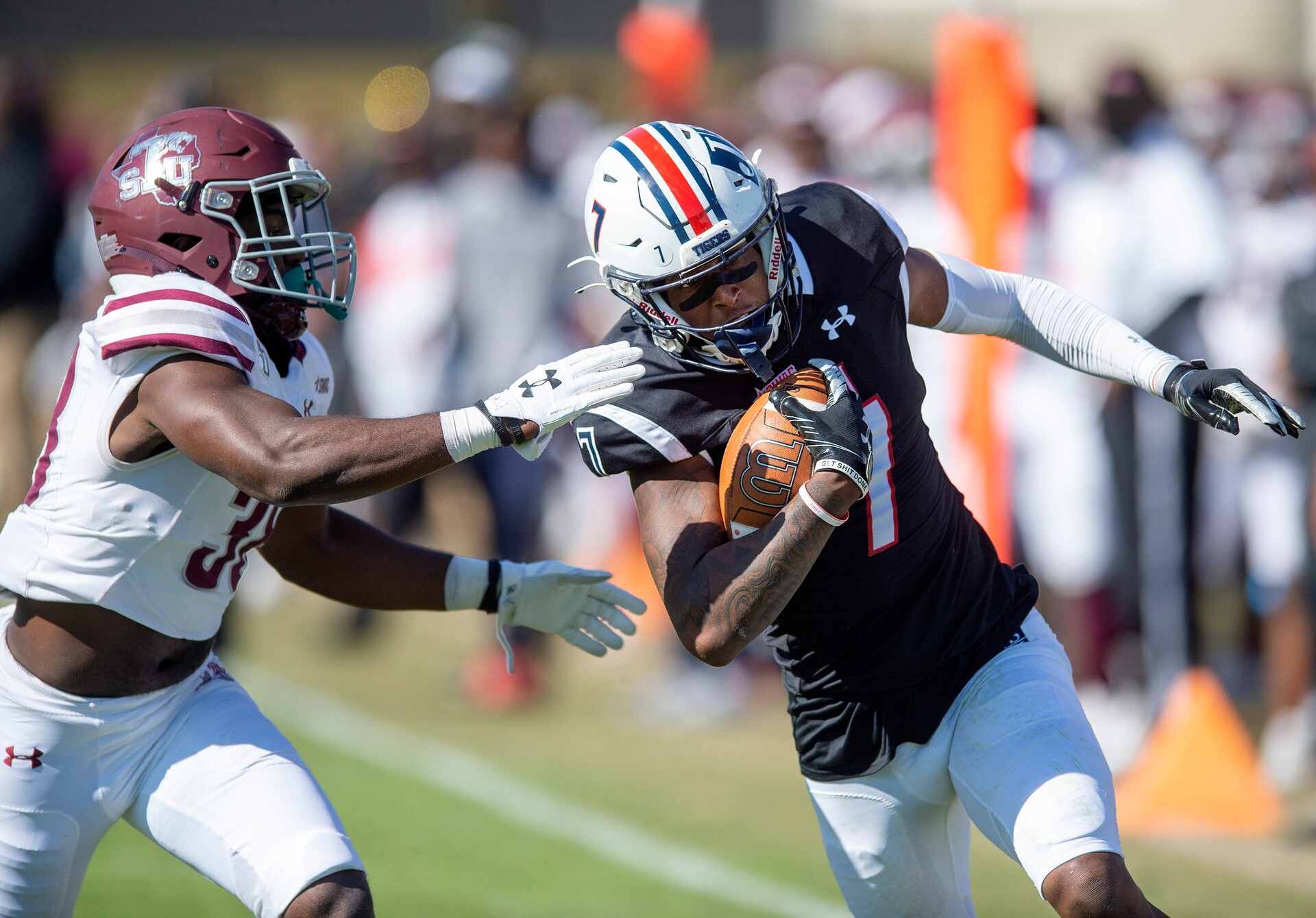 Jackson State University's Keith Corbin III (7) gets around Texas Southern University's Marquis Walker (38) during their game at Mississippi Veterans Memorial Stadium in Jackson, Miss., Saturday, Nov. 6, 2021.