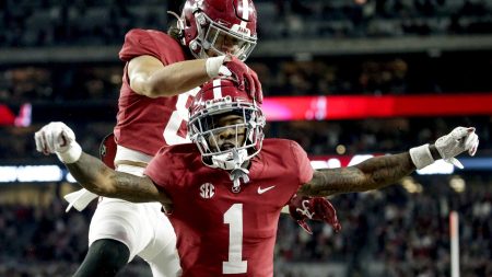 Alabama Crimson Tide wide receiver Jameson Williams (1) celebrates with Alabama Crimson Tide tight end Cameron Latu (81) after scoring a touchdown against the Arkansas Razorbacks during the second half at Bryant-Denny Stadium.