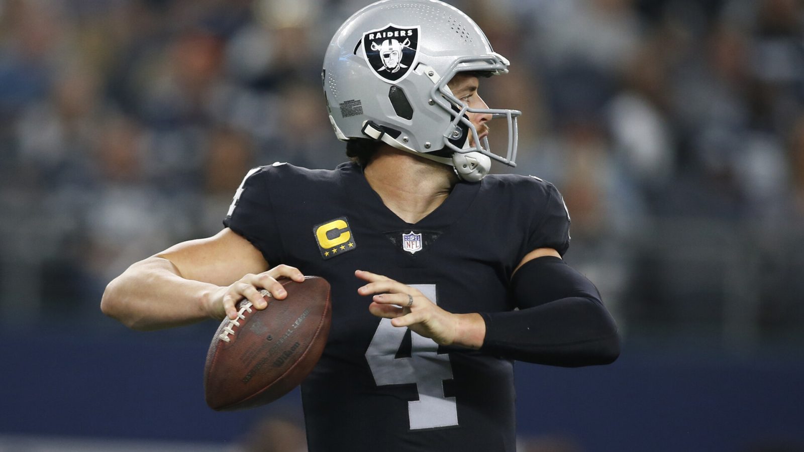 Las Vegas Raiders quarterback Derek Carr (4) throws a pass in the second quarter against the Dallas Cowboys at AT&T Stadium.