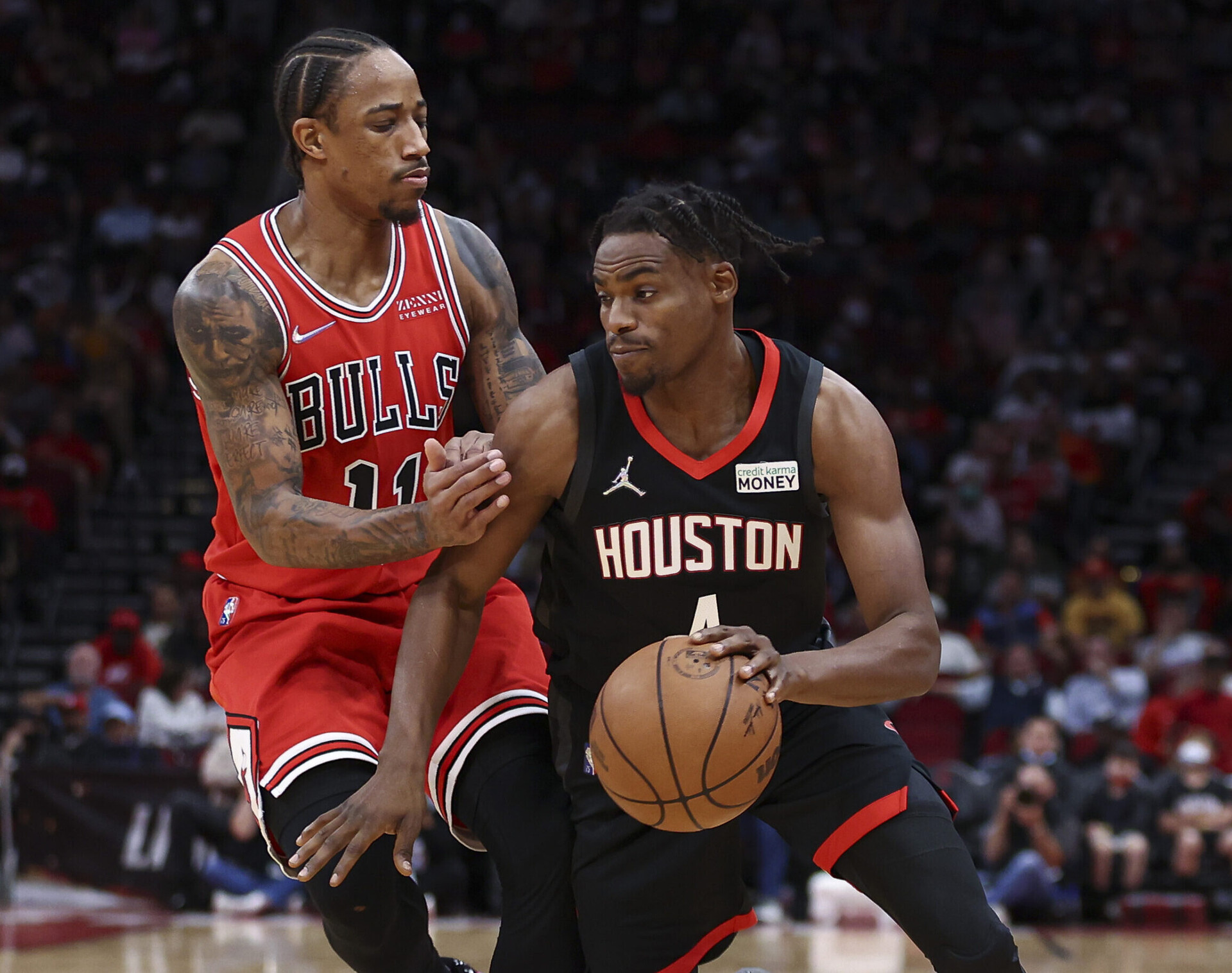 Chicago Bulls forward DeMar DeRozan (left) defends Houston Rockets forward Danuel House Jr. (right) during a game